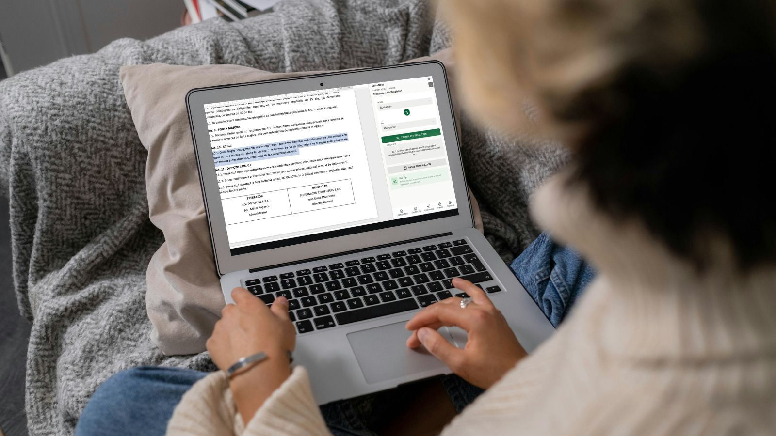 Professional using AI document translation on laptop